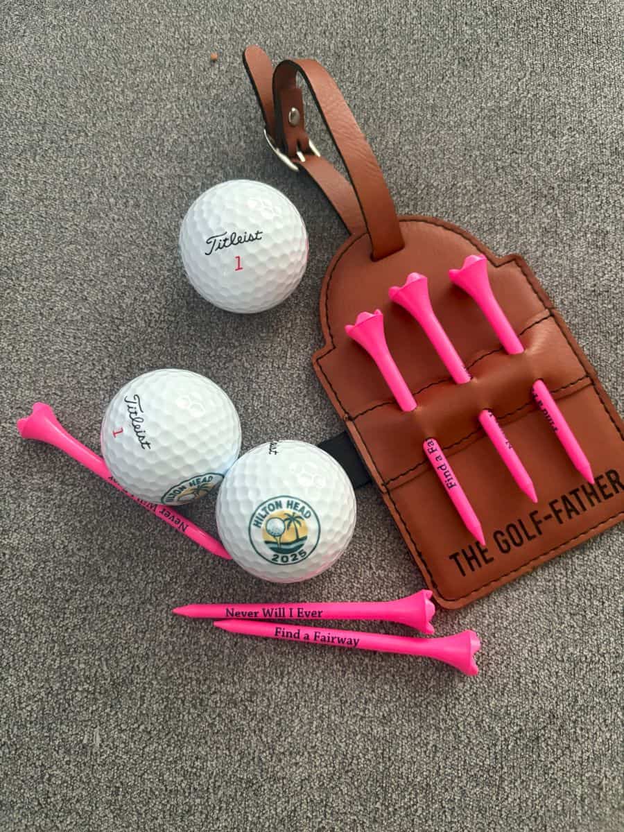 custom golf swag includes pink personalized tees, custom logo golf balls with Hilton Head design, and a personalized tee holder for your golf bag
